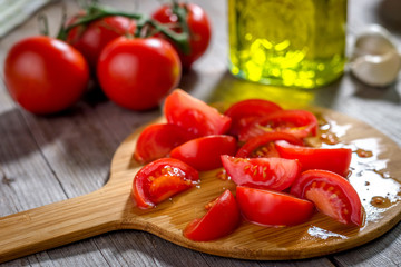 Fresh tomatoes  on a rustic  background
