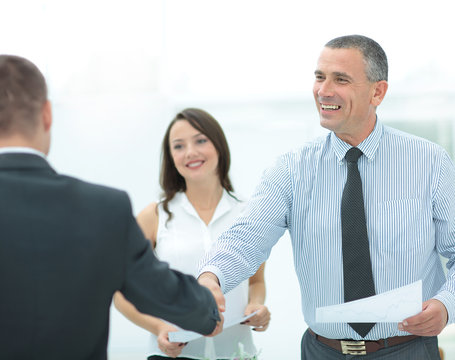 business man handshake with customer in office after signing agr