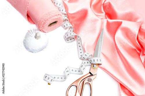 tape pink f(x) concept roll, lie measuring a on tape white Pink background. fabric satin tape pink f(x) concept roll, lie measuring a on tape white Pink background. fabric satin