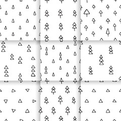 Scandinavian pattern with fir trees and triangles. Seamless winter patterns, hand drawn in black ink. Perfect for gift wrapping or printing on fabric.
