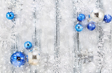 New year theme: Christmas tree white and silver decorations, blue balls, snow, snowflakes,...