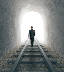 Man walking on railway tracks