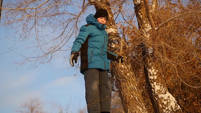 a child jumps into the snow