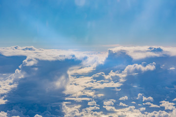 Fototapeta premium Above Clouds Airplane Window Blue Daytime Fluffy Column Wispy Wh