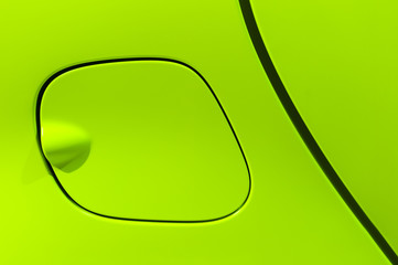 Petrol cap cover of bright green sport sedan car, side part with door of vehicle bodywork, auto industry