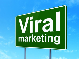 Advertising concept: Viral Marketing on road sign background