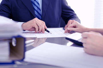 Obraz premium Bookkeepers or financial inspector making report, calculating or checking balance. Audit concept.