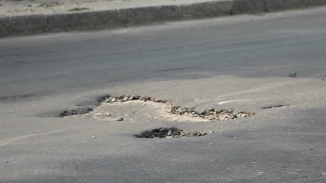 Potholes on the old highway in the city
