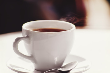closeup cup of coffee or tea in cafe interior