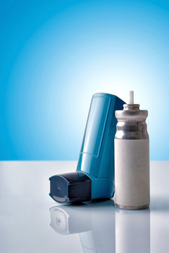 Cartridge and blue medicine inhaler with blue background front v