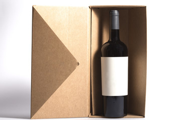 Red wine bottle on a brown paper box