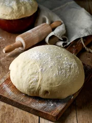 Poster fresh raw dough on wooden table © Mara Zemgaliete