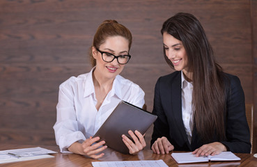 Female colleagues sharing ideas about work