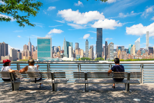 NewYorkers at a park in Queens with a view of the midtown Manhattan skyline