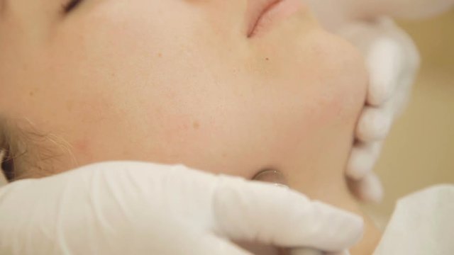 Beautiful woman getting microdermabrasion at beauty clinic