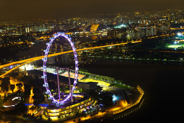 Landscape of the Singapore Marina Bay in night lights from skypark obsevation deck