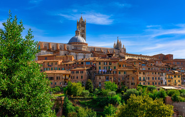 Fototapeta na wymiar View of Dome and campanile of Siena Cathedral (Duomo di Siena) in Siena, Italy.