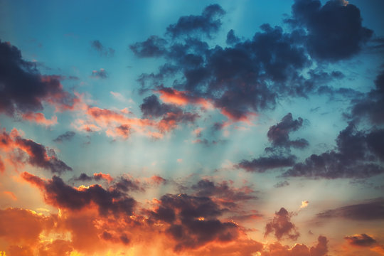 Fototapeta Sunset cloudscape. Beautiful sunrise with fluffy clouds.