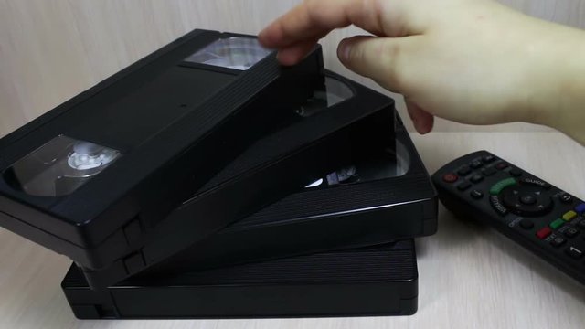stack of VHS video tape cassette