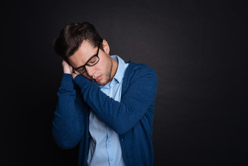 Obraz premium Tired young man sleeping