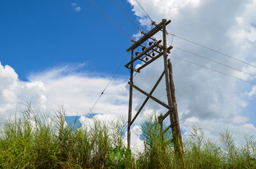 Old wooden elecric pole and power lines