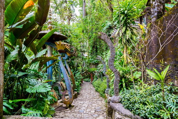 Old concrete monuments decaying in a cloud forest in Mexico. These ancient monuments will soon totally be consumed by the plant life. © Hummingbird Art