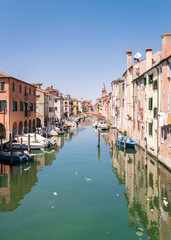 Obraz na płótnie Canvas Characteristic canal in Chioggia, lagoon of Venice.
