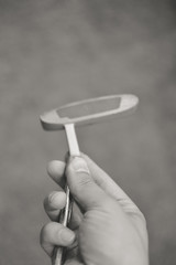Black white picture of golf club in hand, copyspace background