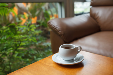 Cup of coffee on table in cafe.