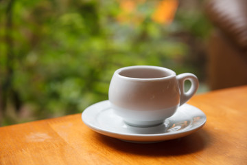 Cup of coffee on table in cafe.