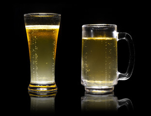 dual or two frosty lager light beer in clear glass set with stea