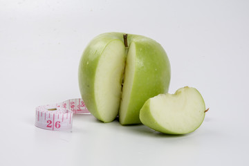 apple and stethoscope on white. Medical concept