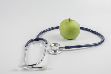 Grape and stethoscope. Medical concept