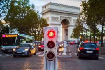 traffic lights in Paris with Arc de Triomphe in background