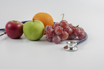 mixed fruit with stethoscope. Medical concept