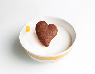 Chocolate cookie heart shaped in white milk