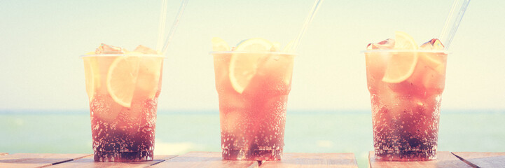 Concept of luxury tropical vacation. Three Cuba Libre cocktails