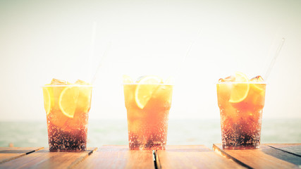 Concept of luxury tropical vacation. Three Cuba Libre cocktails