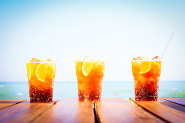 Concept of luxury tropical vacation. Three Cuba Libre cocktails