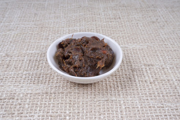 Tamarind paste on small bowl.