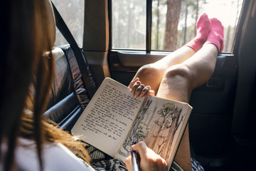 Girl Drawing Pad Road Trip Concept