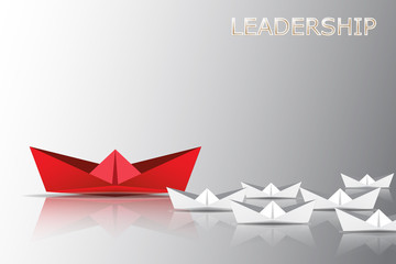 Leadership concept with red paper ship leading among white, Unique and different concept.