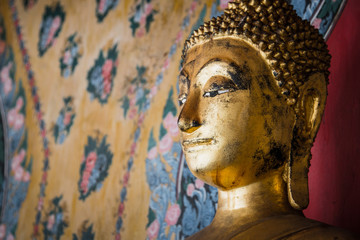 Face of Buddha gold and thai art architecture in Wat Arun buddhist temple in Bangkok, Thailand.Photo taken on: 21 November , 2016