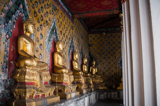  Row of Buddha gold  and thai art architecture in Wat Arun buddhist temple in Bangkok, Thailand.Photo taken on: 21 November , 2016
