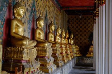 Row of Buddha gold  and thai art architecture in Wat Arun buddhist temple in Bangkok, Thailand.Photo taken on: 21 November , 2016