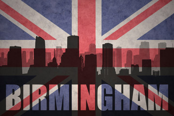 abstract silhouette of the city with text Birmingham at the vintage british flag