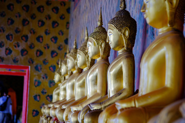 Row of Buddha gold  and thai art architecture in Wat Arun buddhist temple in Bangkok, Thailand.Photo taken on: 21 November , 2016