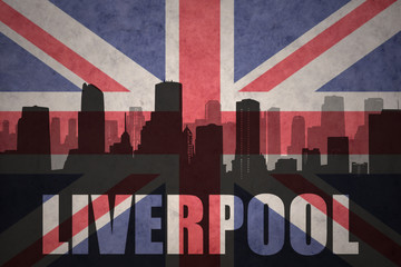 abstract silhouette of the city with text Liverpool at the vintage british flag