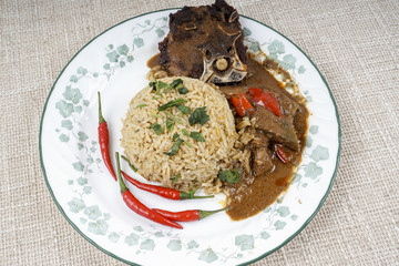 Mutton Byriani - Lamb and rice cooked with spices. Served with raita. Traditional South Asian Cuisine.