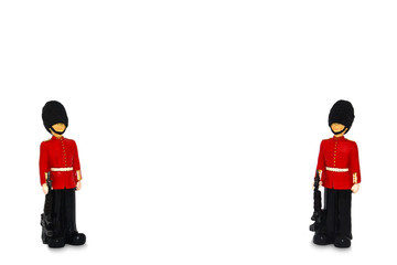 two Queen's guard statue in traditional uniform with weapon, British soldier for background, isolated on white background, copy space